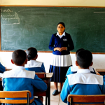 **Prompt:** A classroom scene in a rural Paraguayan school, showing students in modest uniforms attentively listening to a teacher, fully clothed, appropriate attire, safe for work, perfect anatomy, natural proportions, family-friendly, showcasing traditional teaching methods alongside basic technology like a chalkboard.